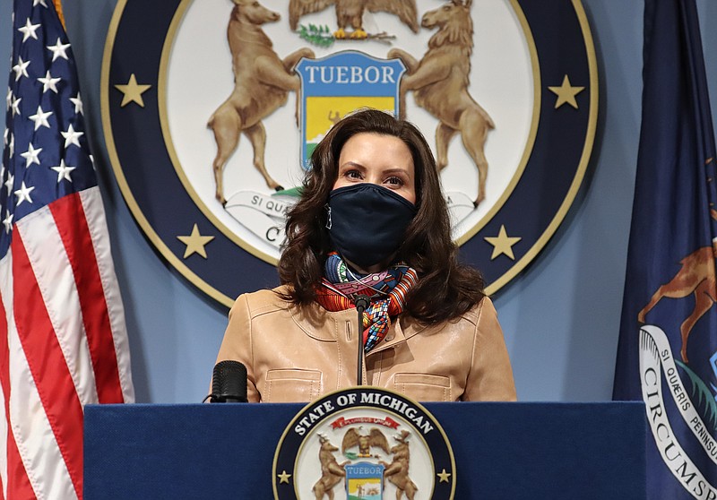 In this photo provided by the Michigan Office of the Governor, Gov. Gretchen Whitmer addresses the state during a speech in Lansing, Mich. Friday, April 9, 2021. Faced with the country's highest rate of new coronavirus infections, Whitmer on Friday urged a two-week suspension of in-person high school classes, all youth sports and indoor restaurant dining. (Michigan Office of the Governor via AP)