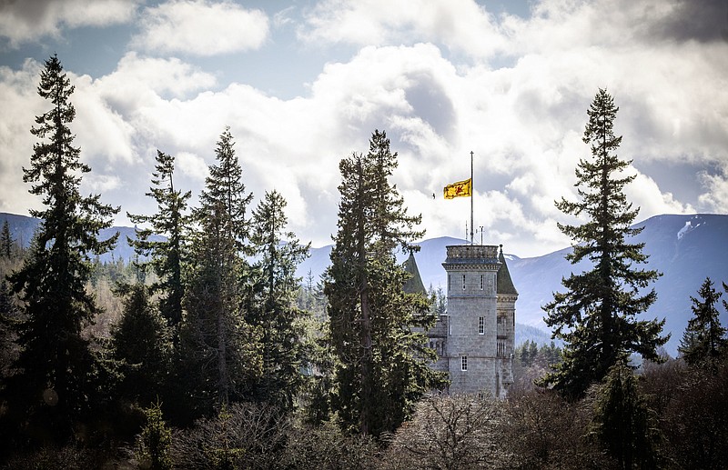 The Lion rampant flies at half mast at Balmoral Castle following the announcement of the death of Britain's Prince Philip, in Aberdeenshire, Scotland, Friday, April 9, 2021. Prince Philip, the irascible and tough-minded husband of Queen Elizabeth II who spent more than seven decades supporting his wife in a role that both defined and constricted his life, has died, Buckingham Palace said Friday. He was 99. - Jane Barlow/PA via AP