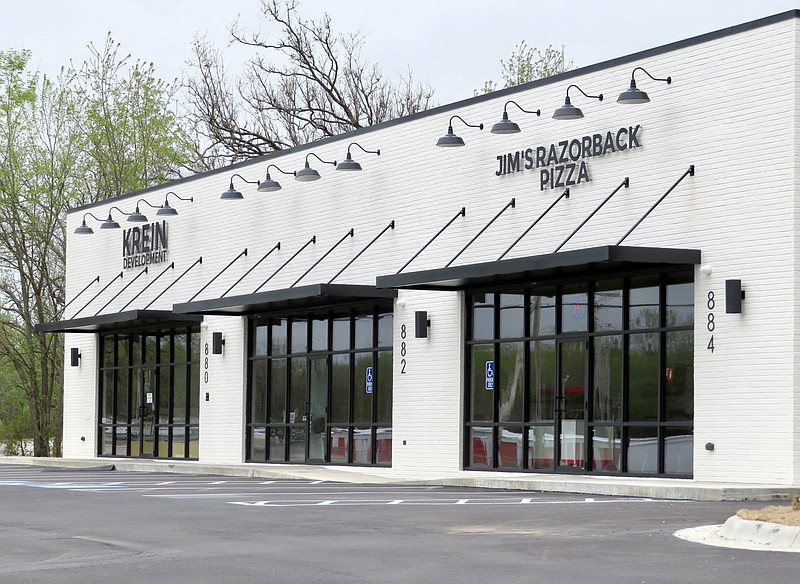 Westside Eagle Observer/RANDY MOLL
Following the completion of the building on Arkansas Highway 59, across from the new Ace Hardware store, Krein Development offices and a new Jim's Razorback Pizza have a new home in Gentry. Jim's Razorback Pizza opened for business last week.