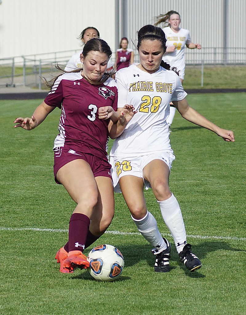 Westside Eagle Observer/RANDY MOLL
Gentry senior Alexis Fowler battles with a Prairie Grove player for control of the ball during play between the two teams at Gentry High School on Friday. Prairie Grove won the match, 1-0. In other games last week, the Gentry girls defeated Clarksville, 2-1. The boys lost to Clarksville, 7-4. Results of the boys' Prairie Grove game were not yet available at press time.