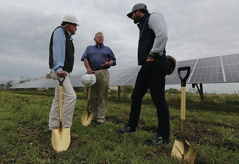 England Mayor Butch House (center) talks with Delta Solar CEO Bob East (left) and Tyler Wilson, also of Delta Solar, after the ceremonial groundbreaking for the city's new solar array on Wednesday, April 7, 2021, in England. Due to weather the solar panels were put up earlier in the week, and should be in service in 3-4 weeks. 
(Arkansas Democrat-Gazette/Thomas Metthe)