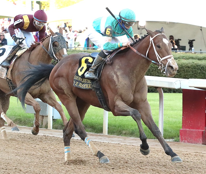 Jockey Florent Geroux and C Z Rocket (6) cross the wire in front of Whitmore (2) and Ricardo Santana Jr. to win the Count Fleet Sprint Handicap at Oaklawn Saturday. - Photo by Richard Rasmussen of The Sentinel-Record