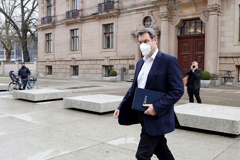 Markus Soeder arrives at the Reichstag building ahead of a news conference following a caucus meeting of Germany's ruling coalition in Berlin on April 11. MUST CREDIT: Bloomberg photo by Liesa Johannssen-Koppitz