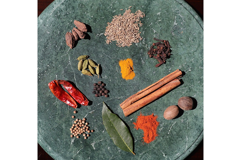 Curry ingredients may include black cardamom pods, cumin seeds, green cardamom pods, ground turmeric, cloves, dried red peppers, black peppercorns, cinnamon sticks, coriander seeds, bay leaf, paprika and nutmeg. (TNS/St. Louis Post-Dispatch/Hillary Levin)
