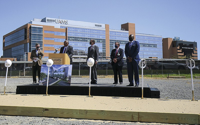 Dr. Stephen Broughton, chairman of the University of Arkansas system Board of Trustees, speaks Monday April 12, 2021 along with, from left. Dr. Cam Patterson,  UAMS Chancellor, Congressman French Hill, Dr. Lowry Barnes, chairman of the Department of Orthopaedic Surgery in the UAMS College of Medicine, and Little Rock Mayor Frank Scott, Jr., during a groundbreaking ceremony for the new UAMS Health Surgical Hospital. More photos at arkansas online.com/413UAMS/. (Arkansas Democrat-Gazette/Staton Breidenthal)