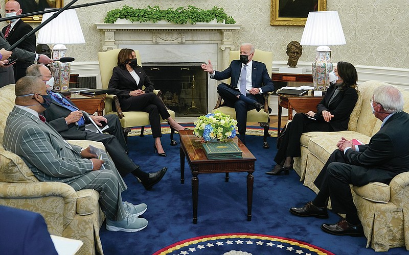 President Joe Biden and Vice President Kamala Harris meet with lawmakers to discuss the American Jobs Plan in the Oval Office of the White House, Monday, April 12, 2021, in Washington. (AP Photo/Patrick Semansky)