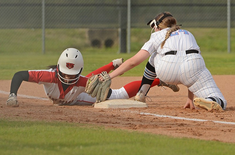 Northside's Callin Massey, left, touches third before the tag by Southside third baseman Reese Robinson on Monday, April 12, 2021 at Grizzly Field in Fort Smith. (Special to NWA Democrat Gazette/Brian Sanderford)