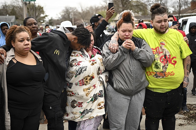 Family and friends of Daunte Wright, 20, grieve at 63rd Avenue North and Lee Avenue North hours after they say he was shot and killed by police, Sunday, April 11, 2021, in Brooklyn Center, Minn. Wright's mother, Katie Wright, stands at center. (Aaron Lavinsky/Star Tribune via AP)