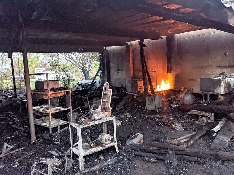 Westside Eagle Observer/SUBMITTED
Fire rekindled itself in a home on School Avenue in Decatur prompting the Decatur Fire Department to return to put out the flareups April 11. The home belonging to Wes and Bailey McGee was a total loss.