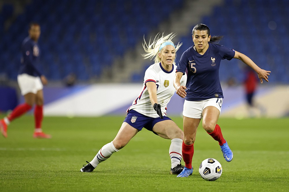 France's Eugenie Le Sommer controls the ball as United States' Julie Ertz (8) defends during an international friendly women's soccer match between the United States and France in Le Havre, France, Tuesday, April 13, 2021. (AP Photo/David Vincent)