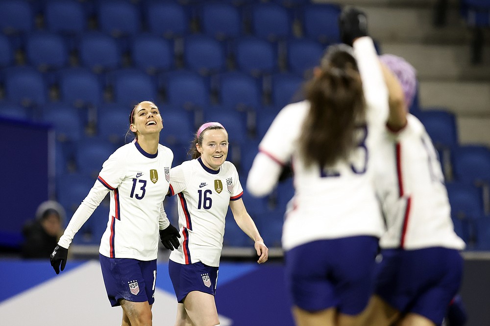 United States' Alex Morgan (13) and Rose Lavelle (16) celebrate after Morgan scored a goal against France during an international friendly women's soccer match between the United States and France in Le Havre, France, Tuesday, April 13, 2021. (AP Photo/David Vincent)
