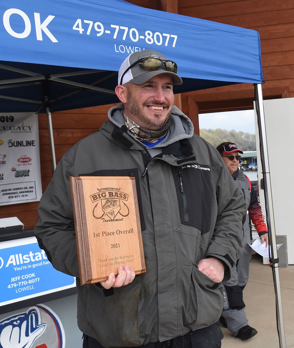 Overall winner Tyler Hickman of Lowell shows his trophy. His big bass weighed 5.85 pounds, caught on a Pop R top-water lure.
(NWA Democrat-Gazette/Flip Putthoff)