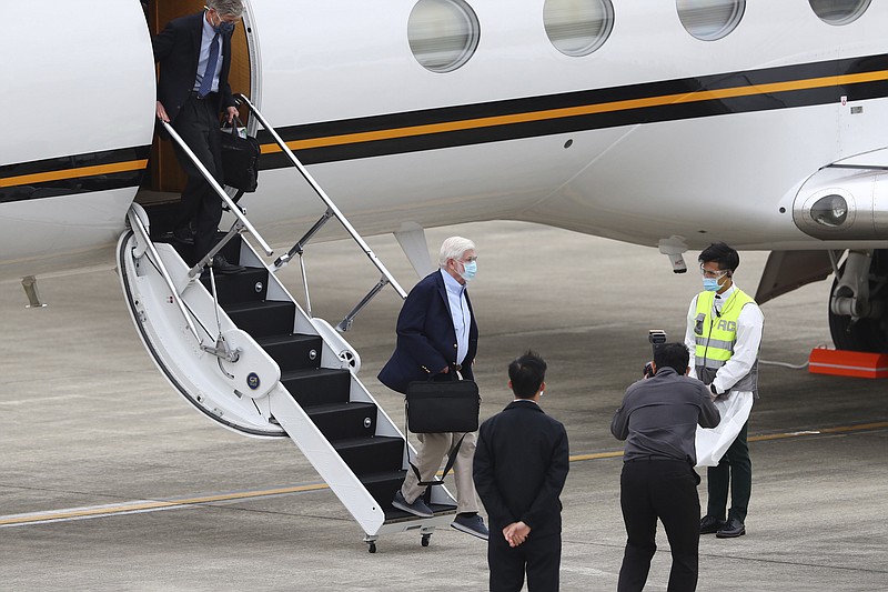 Former U.S. senator Chris Dodd, is followed by former U.S. Deputy Secretary of State James Steinberg as they disembark upon arrival in Taipei, Taiwan on Wednesday, April 14, 2021. The former U.S. senator and two ex-State Department officials arrived in Taiwan on Wednesday at a time of tense relations with China, Taiwan's Foreign Ministry said. (Pool Photo via AP)