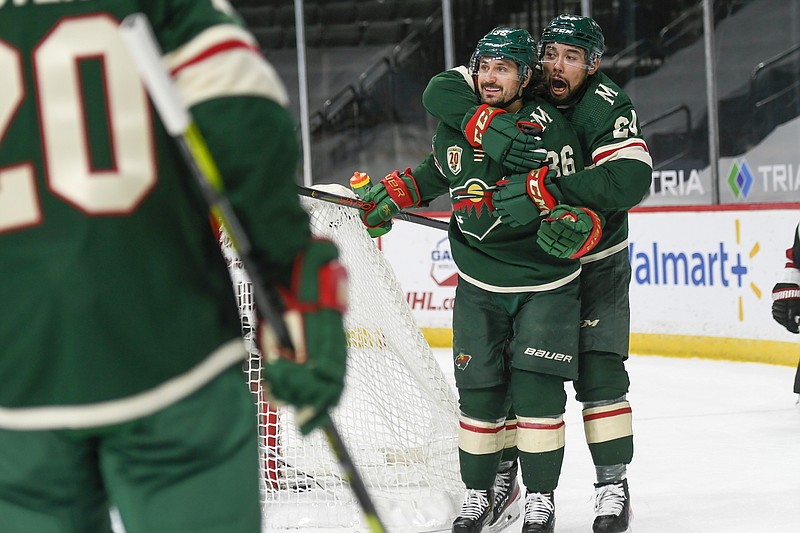 Minnesota Wild right wing Mats Zuccarello, second from right, celebrates with Wild defenseman Matt Dumba after Zuccarello scored a goal against the Arizona Coyotes during the first period of Wednesday's game in St. Paul, Minn. - Photo by Craig Lassig of The Associated Press