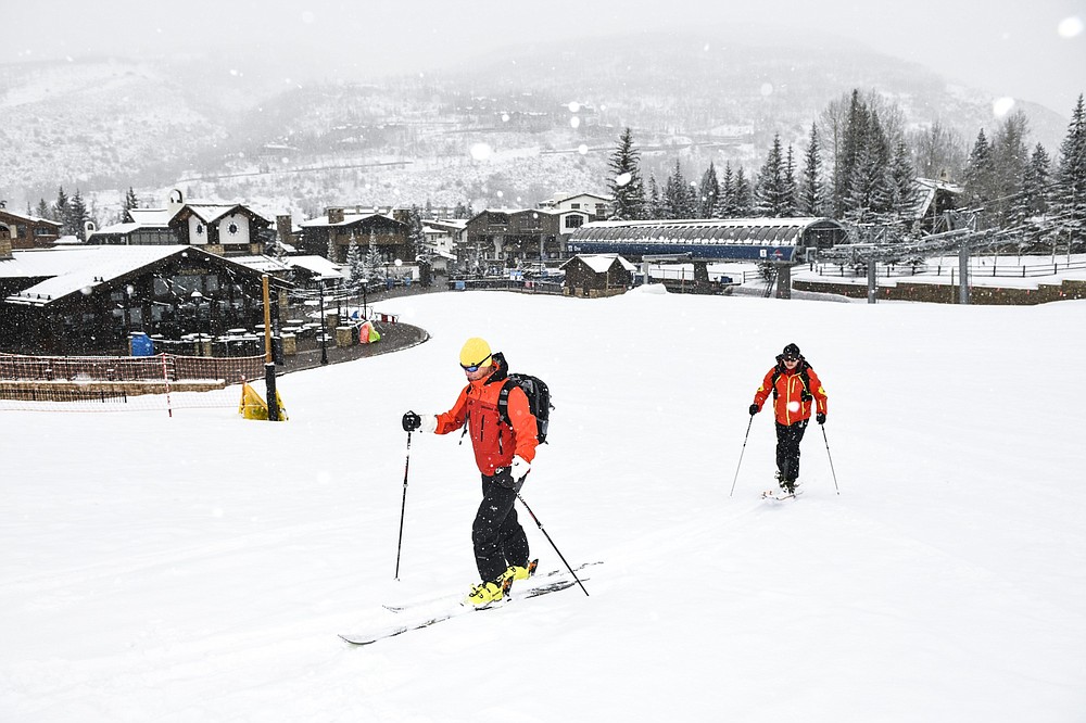 Skiers ski up an empty run at a Vail Resorts Inc. location in Vail, Colo., on March 19, 2020. MUST CREDIT: Bloomberg photo by Michael Ciaglo