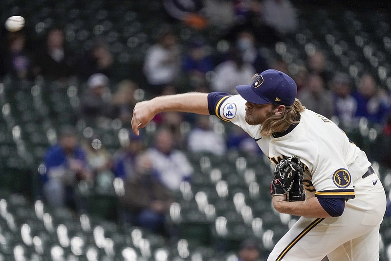Milwaukee Brewers starting pitcher Corbin Burnes throws during the first inning of a baseball game against the Chicago Cubs Wednesday, April 14, 2021, in Milwaukee. (AP Photo/Morry Gash)