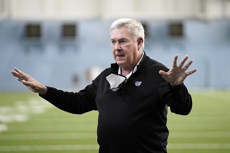 FILE - North Carolina coach Mack Brown speaks prior to his players participating in the school's Pro Day football workout for NFL scouts in Chapel Hill, N.C., in this Monday, March 29, 2021, file photo. The NCAA made it official Thursday, announcing the Division I Council had voted to approve a proposal that would permit all college athletes to transfer one time as an undergraduate without having to sit out a season. “There's over 2,000 kids that went into the football transfer portal,” North Carolina coach Mack Brown said. “The last update that I got was that only 37% had a place to go.”(AP Photo/Gerry Broome, File)