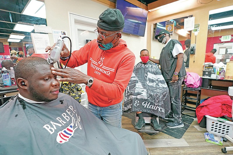 Barbers, artists help defy vaccine myths for people of color