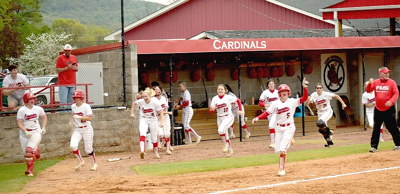 MARK HUMPHREY  ENTERPRISE-LEADER/Farmington sophomore Kamryn Uher leads the cheers as she breaks for home, scoring Farmington's seventh run of the game on teammate Shayley Treat's second home run during an 8-2 victory over Harrison on Thursday, April 15 that may decide the regular season 4A-1 softball conference championship. Uher led off the bottom of the sixth with a single.