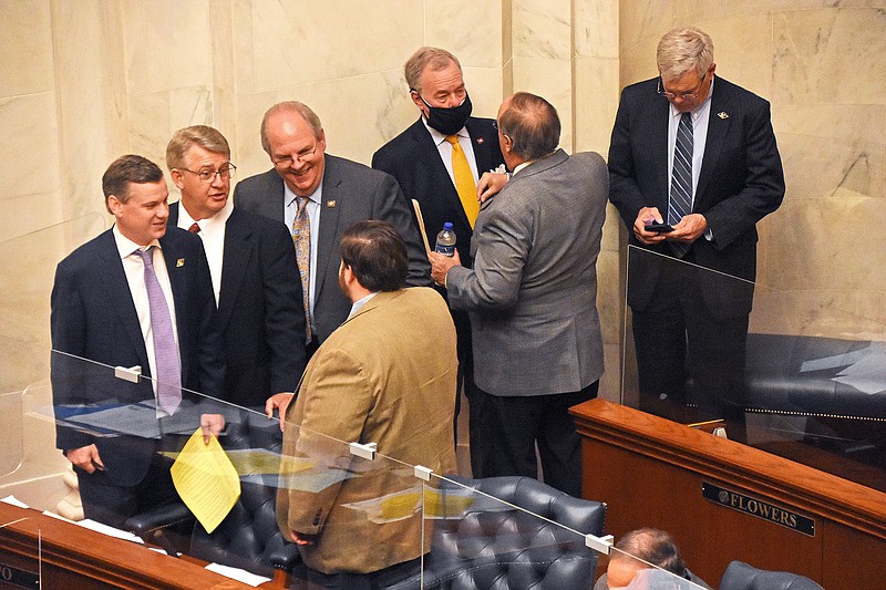 Senators gather to confer during the regular Senate session Thursday at the state Capitol.
(Arkansas Democrat-Gazette/Staci Vandagriff)