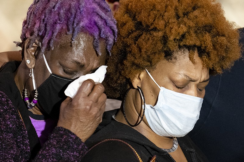 Angie Golson, grandmother of Daunte Wright, cries on the shoulder of Naisha Wright, right, during a news conference at New Salem Missionary Baptist Church, Thursday, April 15, 2021, in Minneapolis. (AP Photo/John Minchillo)