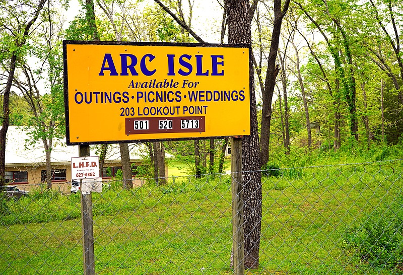 Signage at the entrance to Arc Isle, 203 Lookout Point, is shown on Thursday. - Photo by Cassidy Kendall of The Sentinel-Record