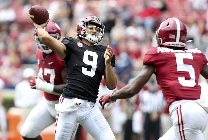 White team quarterback Bryce Young (9) throws over Crimson team defensive back Jalyn Armour-Davis (5) during Alabama's spring NCAA college football game at Bryant-Denny Stadium, Saturday, April 17, 2021, in Tuscaloosa, Ala. (Gary Cosby/The Tuscaloosa News via AP)