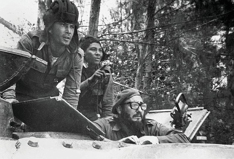 FILE--Cuban leader Fidel Castro, lower right, sits inside a tank near Playa Giron, Cuba, during the Bay of Pigs invasion, in this April 17, 1961, file photo provided by Granma, the Cuban government newspaper. President Kennedy wanted increasing acts of sabotage against Cuba in the days leading to the Cuban missile crisis, more than 400 pages of newly declassified documents reveal, Wednesday, March 21, 2001. (AP Photo/CP Photo, Granma, Raul Corrales, Files)