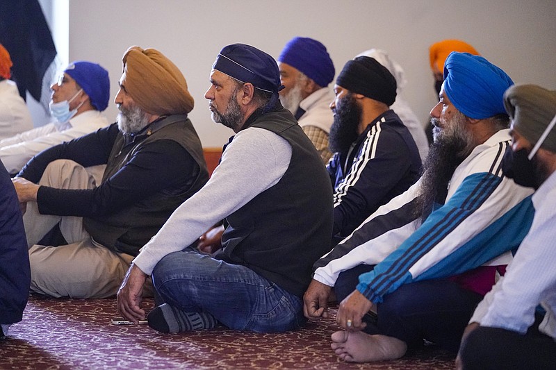 Members of the Sikh Coalition gather at the Sikh Satsang of Indianapolis in Indianapolis, Saturday, April 17, 2021 to formulate the groups response to the shooting at a FedEx facility in Indianapolis that claimed the lives of four members of the Sikh community.   A gunman killed eight people and wounded several others before  taking his own life in a late-night attack at a FedEx facility near the Indianapolis airport. (AP Photo/Michael Conroy)