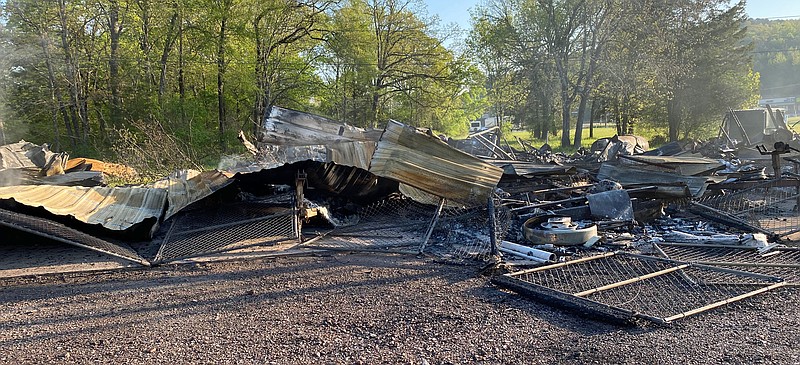 The remains of a commercial building and several other smaller buildings are seen at 3595 Highway 7 north after a chemical fire that erupted Saturday night at the location. - Submitted photo courtesy of the Fountain Lake Fire Department.