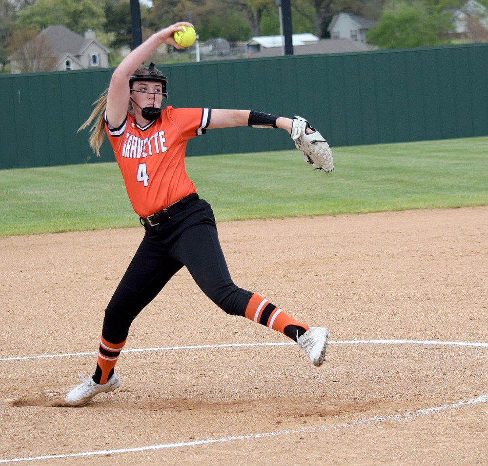 Westside Eagle Observer/MIKE ECKELS
Give me a C, give me an E! Brooke Handle's windup into her delivery looks like she is trying to spell out a word but her unique style delivered a strike over home plate during the third inning of the Gravette-Huntsville conference game in Gravette Thursday night. Handle pitched the entire six inning game, throwing a total of 98 times.