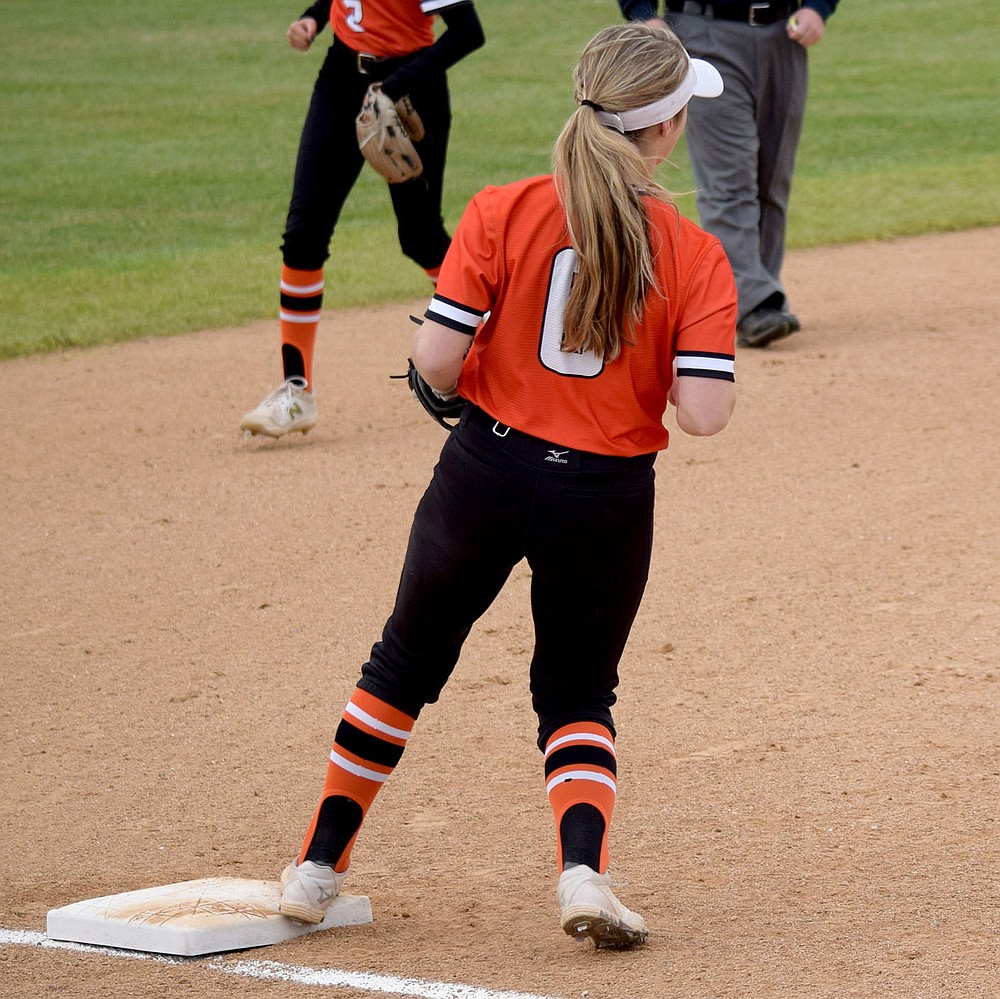 Westside Eagle Observer/MIKE ECKELS
After fielding a ground ball near the pitcher's mound, Lady Lion Lizzy Ellis touches third base for a Lady Eagle out during the Thursday night Gravette-Huntsville conference softball matchup in Gravette. Ellis' effort resulted in the second out in the top of the fourth inning which put the Lady Lions firmly in the lead 11-0.