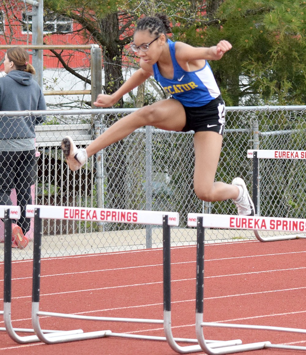 Westside Eagle Observer/MIKE ECKELS
Pryia James leaps over the last hurdle on her was to a first place finish in the 100 meter hurdles for the Decatur junior high girls track team. The Decatur girls brought home a second place trophy from the 2A-1 District Meet in Eureka Springs Friday afternoon.