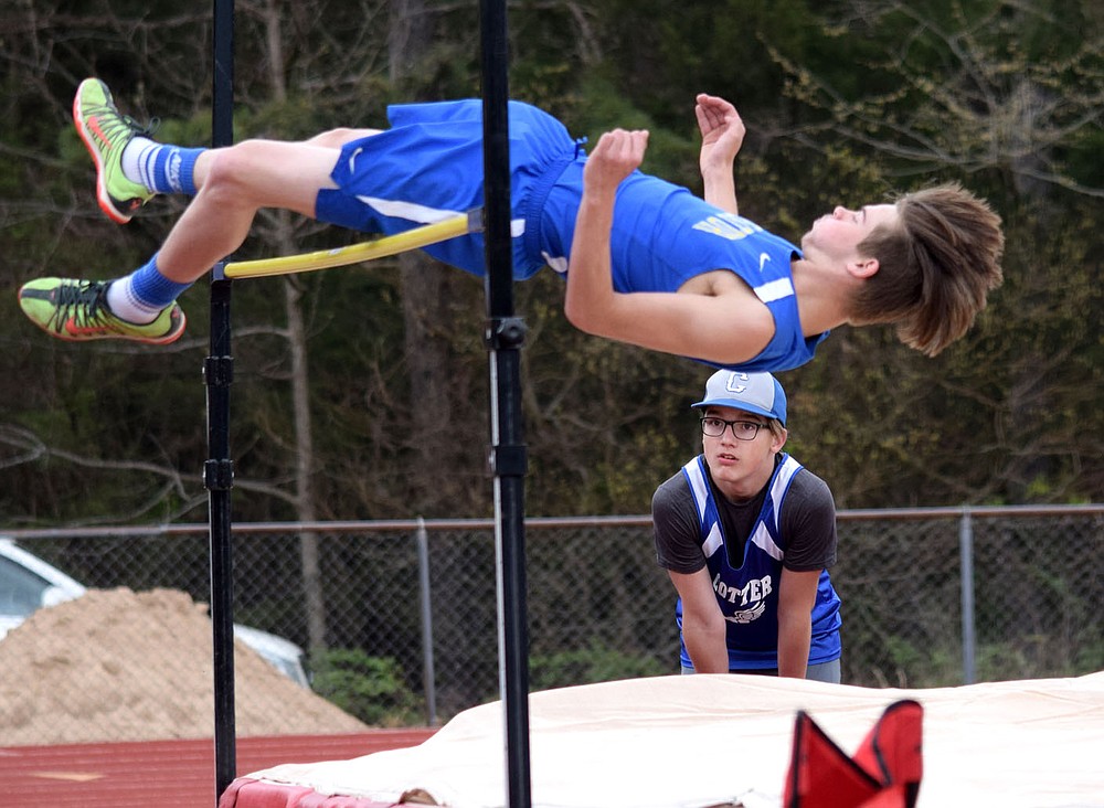 Westside Eagle Observer/MIKE ECKELS
Dayton McGarrah easily clears the five foot six inch mark for a first place finish in the boys high jump during the 2A-1 junior high district track meet in Eureka Springs Friday afternoon, McGarrah, along with teammate Brian Ruiz, led the Decatur boys junior high track team to a second place finish in the district meet.