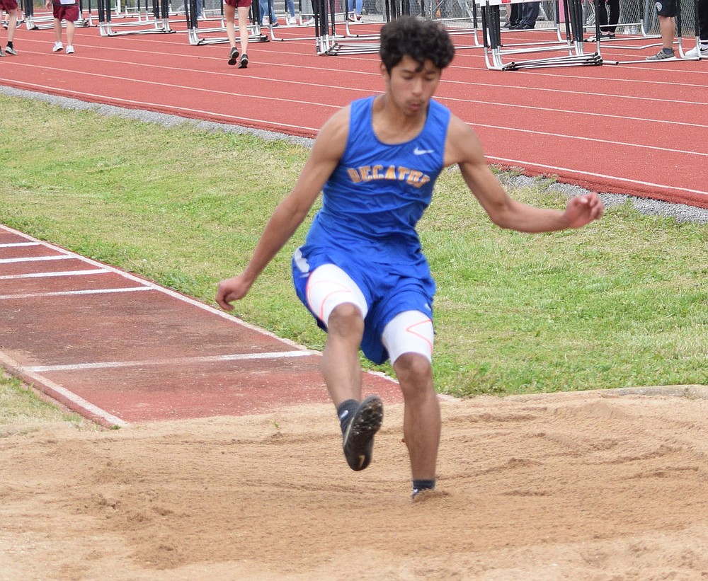 Westside Eagle Observer/MIKE ECKELS
Brian Ruiz sticks his landing as he leaps to a first place finish in the long jump event which was part of the 2A-1 Junior High District Track Meet in Eureka Springs Friday afternoon.