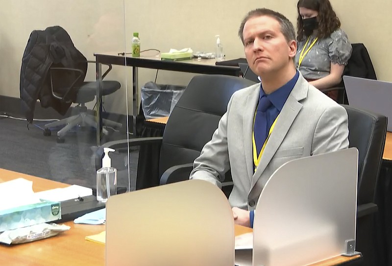 In this image from video, former Minneapolis police Officer Derek Chauvin listens as his defense attorney Eric Nelson gives closing arguments as Hennepin County Judge Peter Cahill preside Monday, April 19, 2021, in the trial of Chauvin at the Hennepin County Courthouse in Minneapolis. Chauvin is charged in the May 25, 2020 death of George Floyd.  (Court TV via AP, Pool)