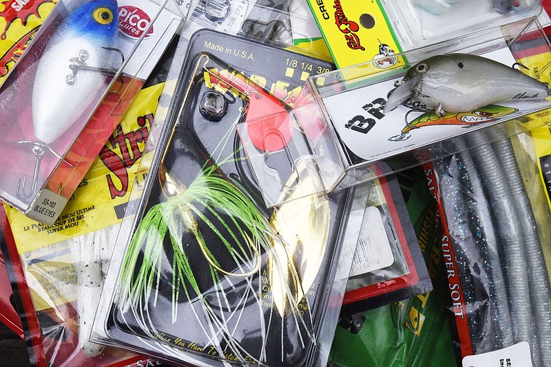 Not only does the 2021 fish story champion win a nice selection of fishing lures, two $100 gift cards are part of the prize package.
(NWA Democrat-Gazette/Flip Putthoff)