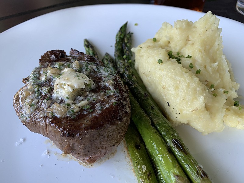 Smoked onion butter tops Cypress Social's 6-ounce filet, which comes with mashed potatoes and grilled asparagus. (Arkansas Democrat-Gazette/Eric E. Harrison)