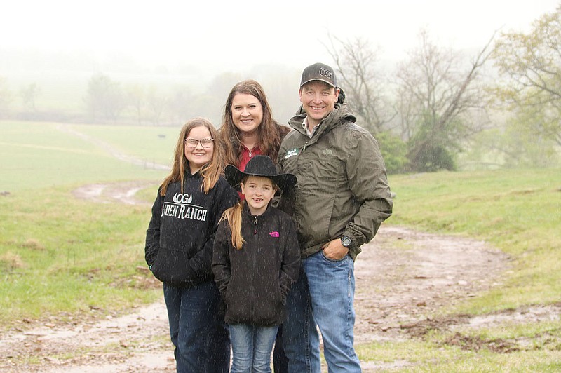 LYNN KUTTER ENTERPRISE-LEADER
A farm day goes on, whether it's sunny or raining and muddy. Nathan and Tracy Ogden and their children, Oaklie and Huntlea, were named the 2020 Washington County Farm Family of the Year. With the covid-19 pandemic, the farm located near Prairie Grove ramped up its direct beef sales operation to meet demand.