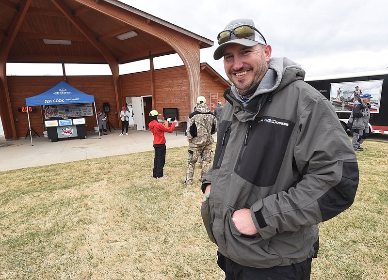 Tyler Hickman waits to receive his check and trophy on April 17 2021 at the Pagnozzi Parker Charities Big Bass Tournament.
(NWA Democrat-Gazette/Flip Putthoff)