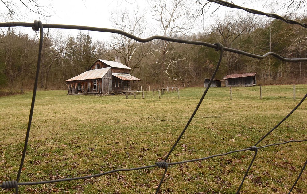 The home, barn and outbuildings of the Parker-Hickman farmstead, seen here on March 12 2021, can be explored by visitors to the Buffalo National River. The farmstead is north of Jasper, one-half mile west of Erbie campground.
(NWA Democrat-Gazette/Flip Putthoff)