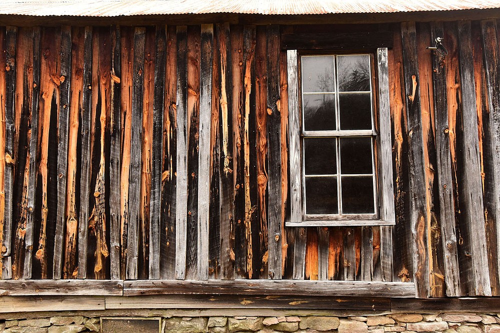 Decades have created a pallette of color on an outside wall of the Parker-Hickman home.
(NWA Democrat-Gazette/Flip Putthoff)