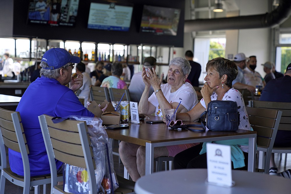 The Associated Press
Baseball fans gather in the Bullpen Club at George M. Steinbrenner Field before a spring training exhibition baseball game between the New York Yankees and the Toronto Blue Jays in Tampa, Fla., on March 24.
