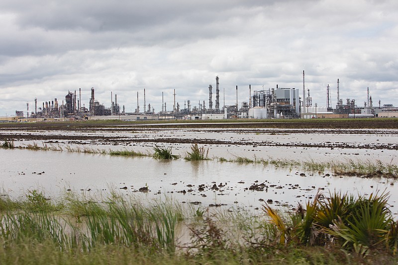 Industrial plants and flooded farmland cover much of the landscape in St. James Parish, La., not far from where Formosa hopes to build a huge plastics manufacturing complex. MUST CREDIT: Photo for The Washington Post by Camille Lenain