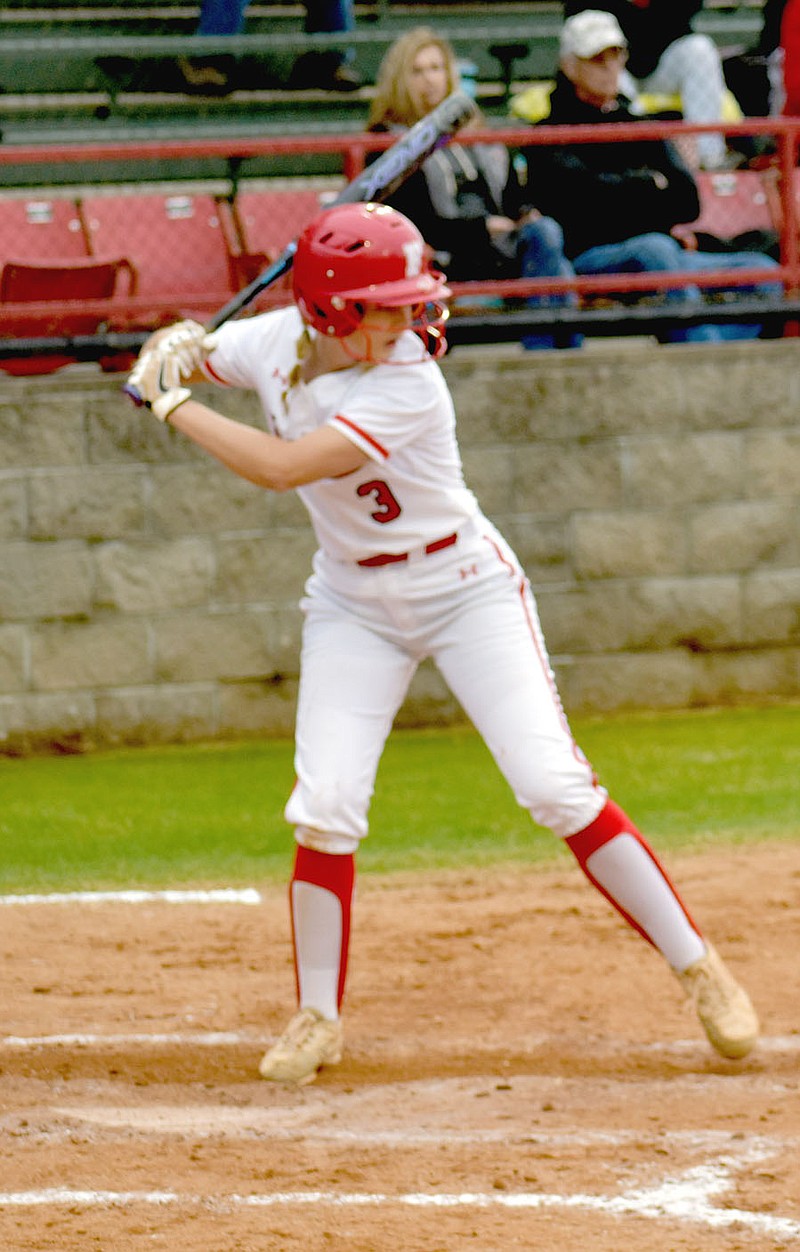 MARK HUMPHREY  ENTERPRISE-LEADER/Farmington senior shortstop Shayley Treat went yard twice including a 2-run shot in this at-bat fueling the Lady Cardinal offense with 6 RBIs during an 8-2 win over Harrison that kept Farmington in the driver's seat toward a 4A-1 softball conference championship.