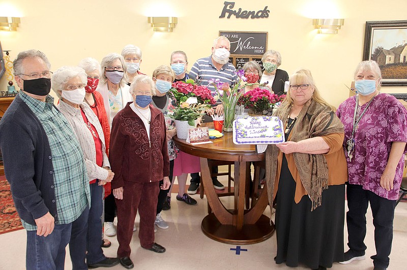 LYNN KUTTER ENTERPRISE-LEADER
Linda Willke, holding the cake, had a reception in her honor Friday in celebration of her retirement from Prairie Grove Senior Activity and Wellness Center. She's been site director for 12 years.