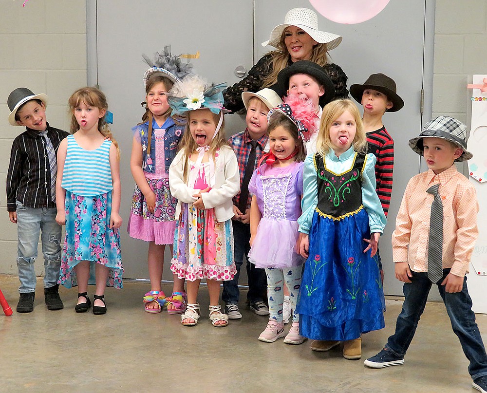 Westside Eagle Observer/RANDY MOLL
Young students, with their teacher, Helen Castillo, made funny faces for their mothers at the Mommy and Me Tea Party held at the Gentry Early Learning Academy on Friday.