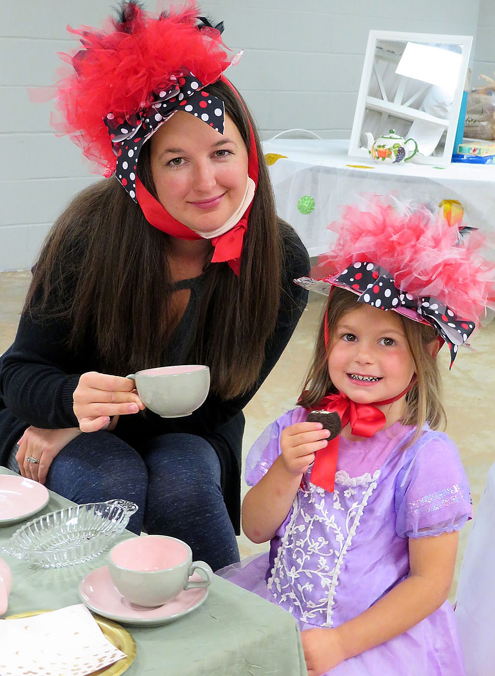 Westside Eagle Observer/RANDY MOLL
Ashlea and Ella Parker enjoyed tea time and a cookie together at the Mommy and Me Tea Party held at the Gentry Early Learning Academy on Friday.
