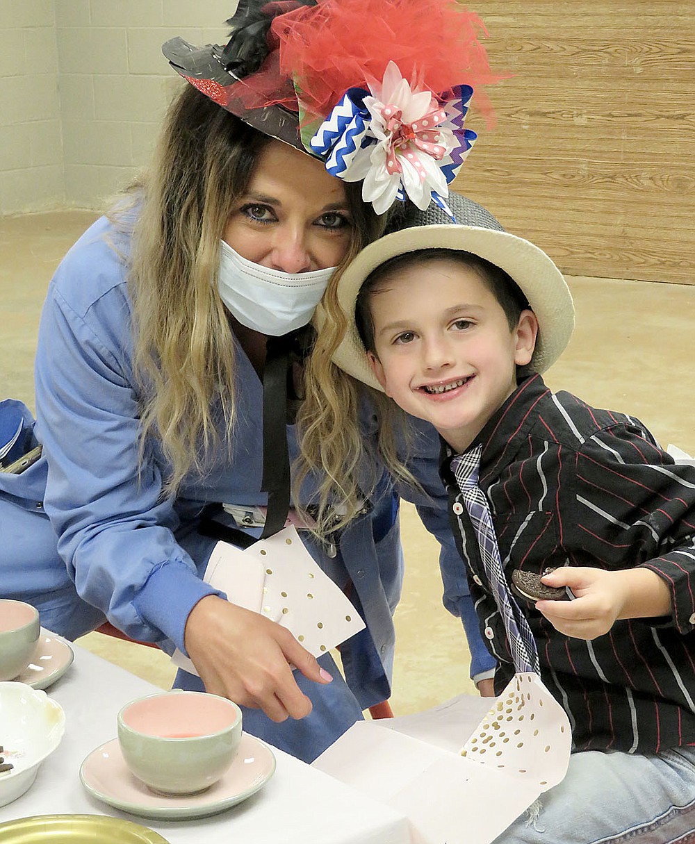 Westside Eagle Observer/RANDY MOLL
Nicole Rebideaux and her son Braxton Roth enjoyed tea time and a cookie together at the Mommy and Me Tea Party held at the Gentry Early Learning Academy on Friday.