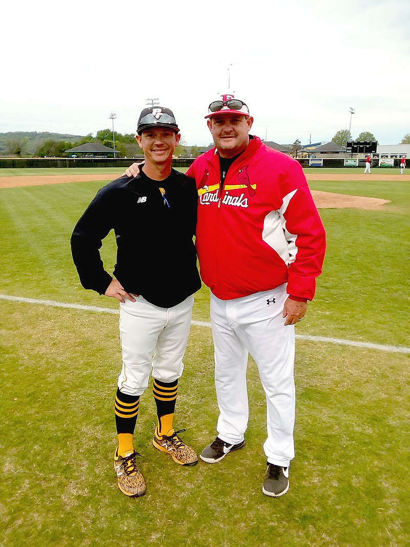 MARK HUMPHREY  ENTERPRISE-LEADER/Coaching rivals (from left) Mitch Cameron, of Prairie Grove; and Jay Harper, of Farmington enjoy a renewed personal rivalry with Cameron returning to the Tigers after a stint at Rogers Heritage from 2016-2019 adding to the 'Battle of 62' baseball competition between the two schools. Both coaches seek to win at every opportunity, yet remain good friends once the game is over.